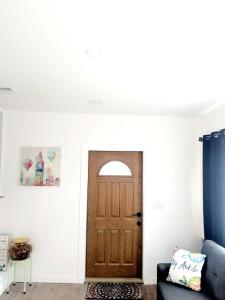 a room with a door and a blue couch at Cozy Guesthouse in Catasauqua +10 photos