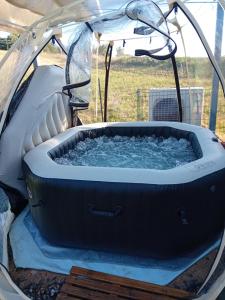 a hot tub in a tent with at ROUPILLON A JANET in Curvalle
