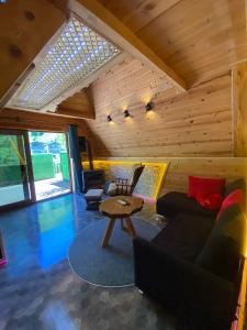 a living room with a couch and a table at ELASYA BUNGALOV in Rize
