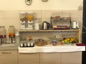 a kitchen with a counter with fruits and food on it at La Mimosa in Pula