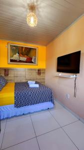 TV a/nebo společenská místnost v ubytování Cantinho do Pequeno Arthur