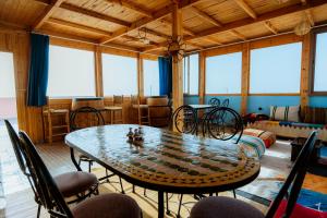 a dining room with a table and chairs at The Ocean Surf Villa in Dakhla