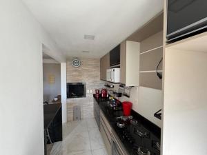 Kuchyň nebo kuchyňský kout v ubytování VVCC Apto Dois quartos Centro de Canoas Rua Brasil