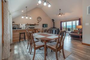 a dining room and kitchen with a table and chairs at Sunset Cabin Privacy, Views, HotTub, Firepit, BBQ, Pets in Rileyville