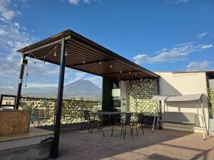 a pavilion with a table and chairs on a patio at Cozy & Modern apartment in Arequipa!! in Arequipa