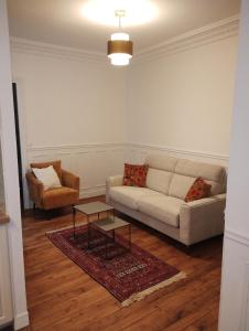 Et opholdsområde på Charming apartment Paris + 1 billede