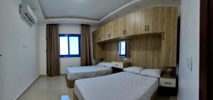 Postel nebo postele na pokoji v ubytování isis MARINA