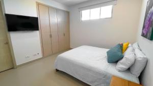 Ένα ή περισσότερα κρεβάτια σε δωμάτιο στο Magico Apartamento Frente al Mar 3 Habitaciones AR42