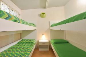 Postel nebo postele na pokoji v ubytování Camping Poseidonia