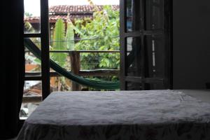 Ένα ή περισσότερα κρεβάτια σε δωμάτιο στο Rudá Hostel