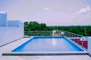 a swimming pool on the roof of a house at Blerina House in Mombasa