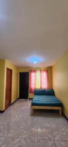 a bedroom with a bed in a room with two windows at Stay at Amazing Grace 