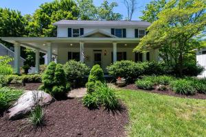a house with landscaping in front of it at The Maple House Fully Fenced-in Yard! in Saugatuck
