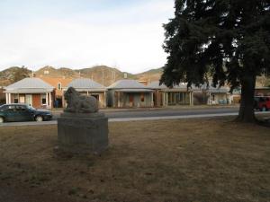 a statue of a lion sitting in a park at Quaint Home On Alpine Park, Downtn Salida Str461 in Salida