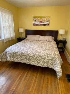 a bedroom with a large bed with a wooden floor at Quaint Home On Alpine Park, Downtn Salida Str461 in Salida