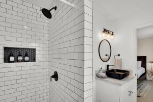 a white bathroom with a sink and a mirror at 3br 2bth, 10 Min To Jtnp, Ev Charger, Zen Garden in Joshua Tree +34 photos