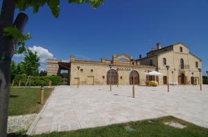 a large building with a courtyard in front of it at Country House La Gioconda in Corropoli