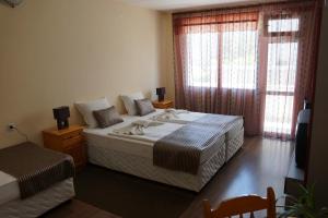 Postel nebo postele na pokoji v ubytování Stemak Hotel