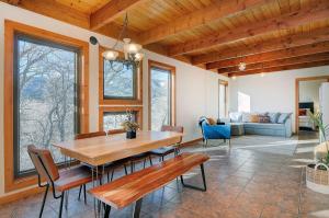 a dining room with a wooden table and chairs at Casa Salida! 1 Mile From Dwntwn, Private Hot Tub in Salida