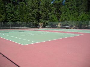 a tennis court with two tennis nets on it at Leavenworth Camping Resort Lakeview Lodge 2 in Leavenworth