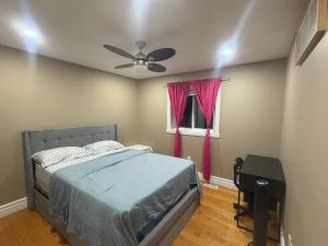 a bedroom with a bed and a ceiling fan at Windsor Home Room 3 in Windsor