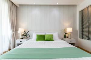 Ένα ή περισσότερα κρεβάτια σε δωμάτιο στο VIP Dream Suite Residence, Klong Muang Beachfront Krabi