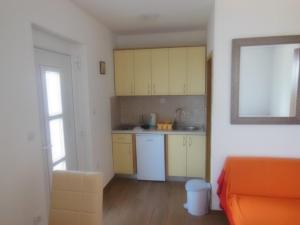 Kuchyň nebo kuchyňský kout v ubytování Apartments Maslina