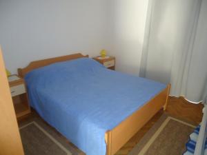 Postel nebo postele na pokoji v ubytování Apartments Maslina