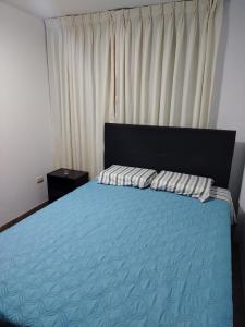 Postel nebo postele na pokoji v ubytování Acogedora Habitación