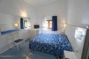 Postel nebo postele na pokoji v ubytování Hotel La Playa