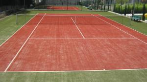 a tennis court with two tennis nets on it at Perun Guest House in Mlini