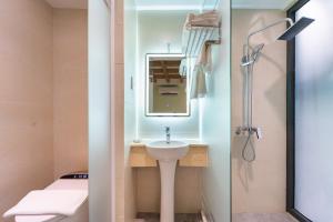 a bathroom with a sink and a shower at Nicecy Hotel - Trương Quyền in Ho Chi Minh City +64 photos