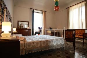 A bed or beds in a room at Pepè Concetta e la movida
