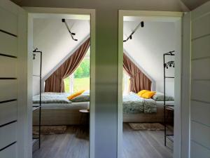 Postel nebo postele na pokoji v ubytování Domki Szychówka