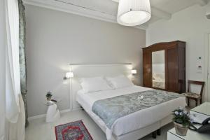 En eller flere senger på et rom på Chiara - Lodge