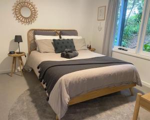 a bedroom with a bed with a teddy bear on it at Mt Martha - Mar Vista - Panorama views with Modern coastal style in Mount Martha