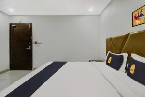 Hotel O D Suites客房内的一张或多张床位