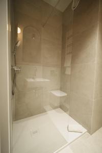 a bathroom with a shower and a sink at NA WYDMIE Apartments&Camp in Dziwnówek
