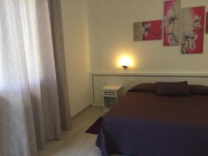 Llit o llits en una habitació de Albergo Ester
