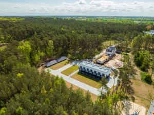 an aerial view of a building in the woods at NA WYDMIE Apartments&Camp in Dziwnówek