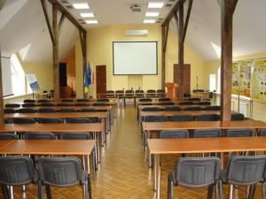 a lecture room with tables and chairs and a screen at Perlyna Karpat in Slavske +83 photos