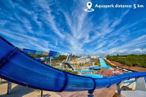 an amusement park with a slide at an amusement park at Aminess Vival Maestral Hotel in Novigrad Istria