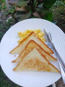 a white plate with two slices of toast on it at Ebucu in Kuta Lombok +33 photos