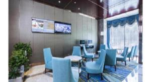 Uma televisão e/ou sistema de entretenimento em Metropolo Hotel Yining Development Zone Hanma Building