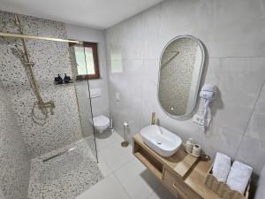 a bathroom with a shower and a sink and a mirror at Cherry Hill Loft in Plitvička Jezera +11 photos