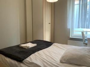 Ένα ή περισσότερα κρεβάτια σε δωμάτιο στο Apartament Związkowiec