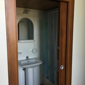 a bathroom with a sink and a shower at Appartamento Esmeralda in Tortoreto Lido
