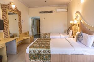 Ένα ή περισσότερα κρεβάτια σε δωμάτιο στο HOTEL BASERAa