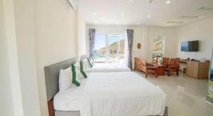 Postel nebo postele na pokoji v ubytování KyCo Peninsula Quy Nhon Resort