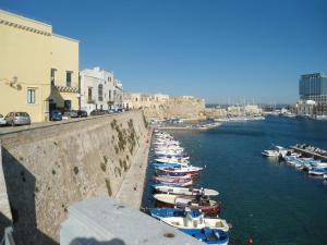 a group of boats are docked in a harbor at Appartamento Gallipoli in Gallipoli